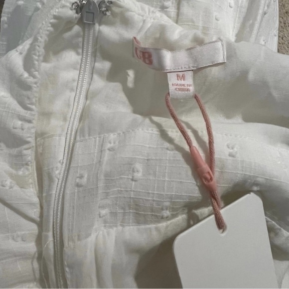 G B Fit and Flare White Halter Neck Cutout Twist Front Clip Dot Dress - Picture 6 of 7